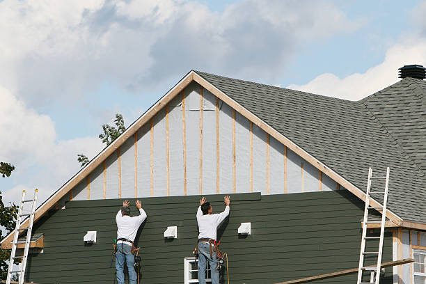 Professional Storm Damage Siding Repair technician working in Fairfield, OH